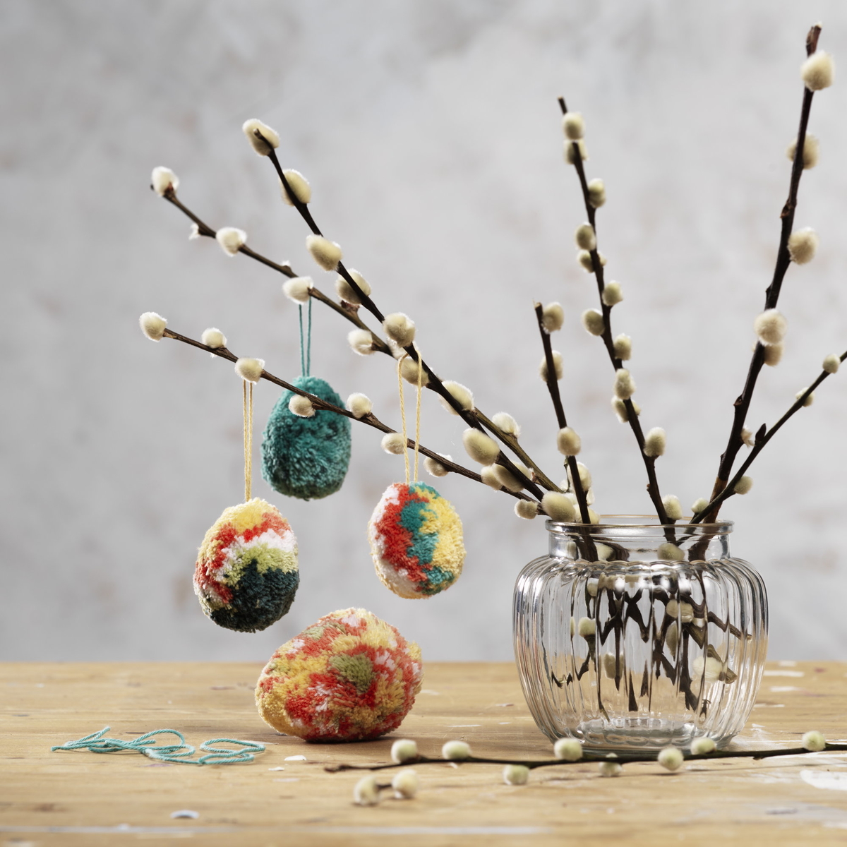 Decorate with fluffy pompom eggs